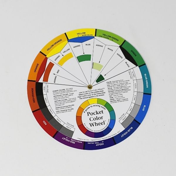 Pocket Color Wheel Mixing Guide showing a rotating color wheel with primary, secondary, and complementary colors for color mixing and coordination.
